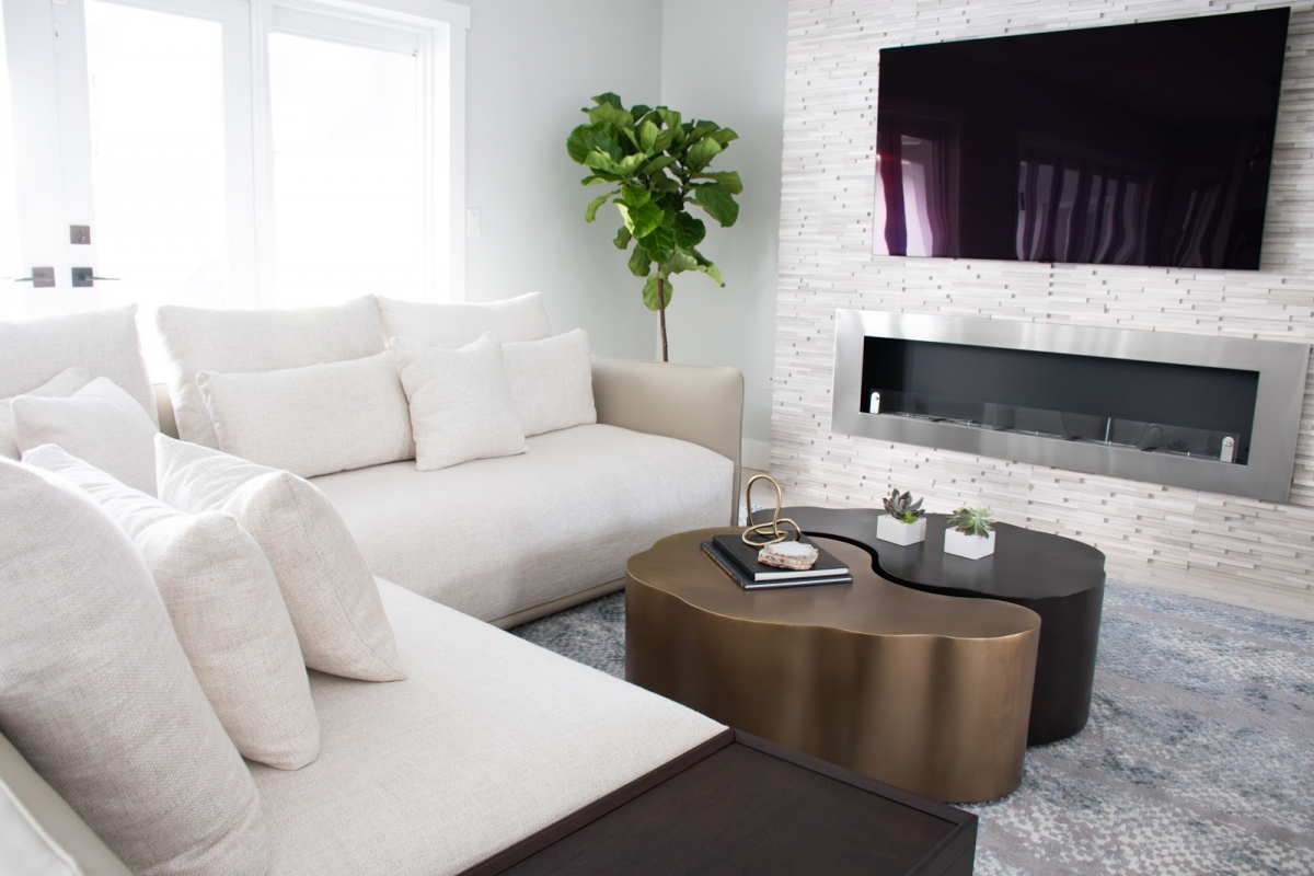living room cozy classic refreshing retreat stone fireplace white sofa yin yang coffee tables, miami