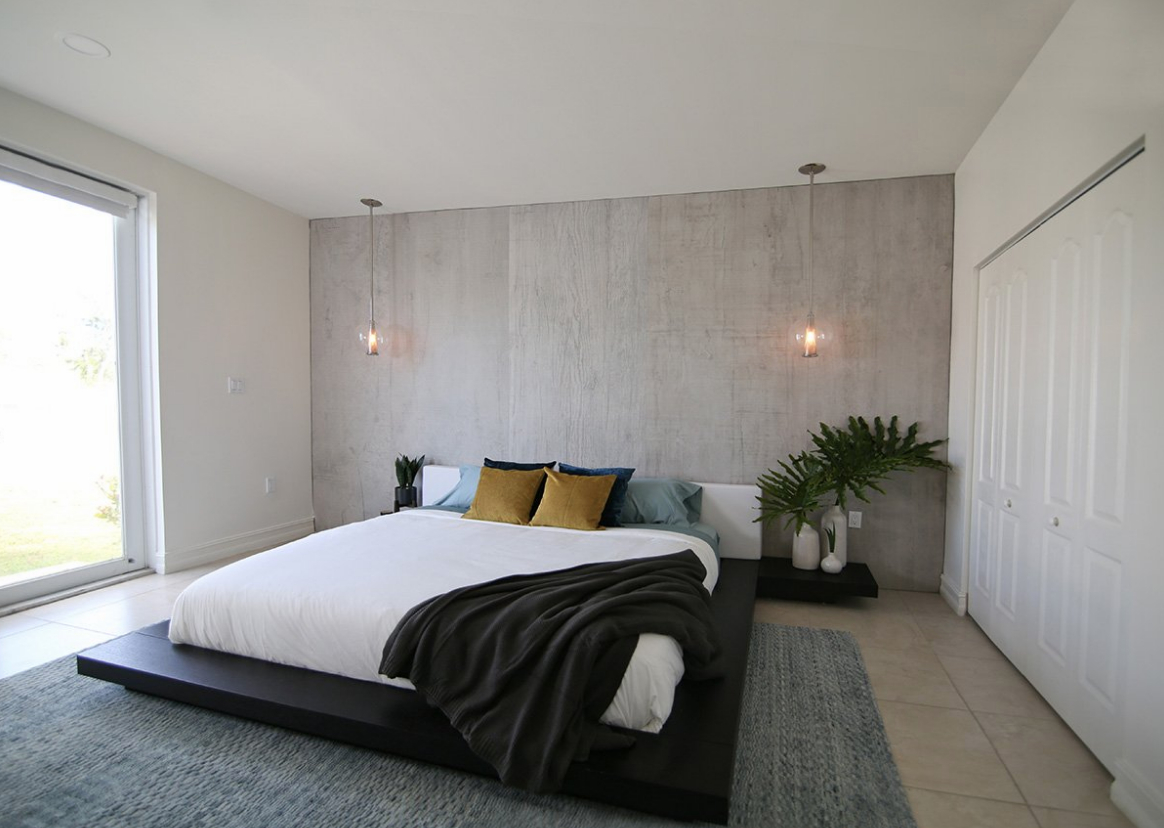 modern interior design master bedroom darla powell interiors concrete wall pendant lights velvet pillows